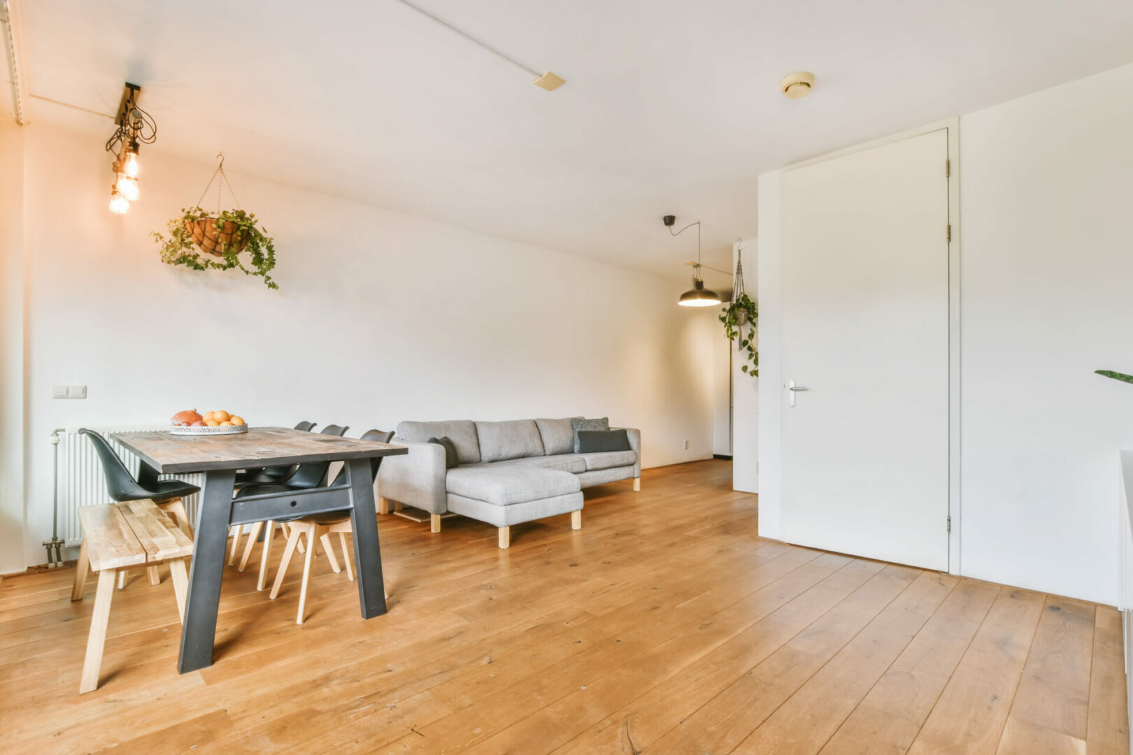 Minimalist style dining zone in modern apartment